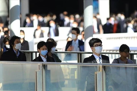 Практически все японцы осознают важность ношения масок для лица (Фото: aa.com.tr)