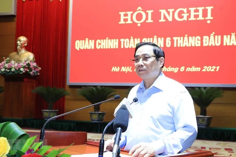 Премьер-министр Фам Минь Тьинь выступает на конференции. (Фото: Чонг Дык/ВИА)
