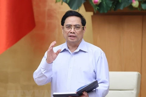 Премьер-министр Фам Минь Тьинь на заседании. (Фото: ВИА)