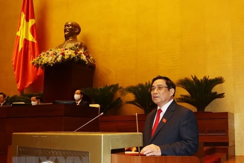 Премьер-министр Фам Минь Тьинь выступает на заседании 26 июля первой сессии Национального собрания. (Фото: Чи Зунг/ВИА)