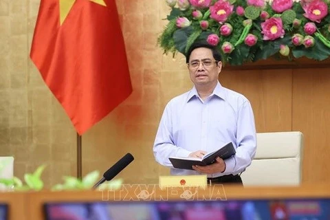 НС приняло решение утвердить предложение президента государства, согласно которому премьер-министр Фам Минь Тьинь будет заместителем председателя Совета национальной обороны и безопасности. (Фото: ВИА)