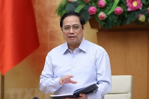 Премьер-министр Фам Минь Тьинь председательствовал на заседании. (Фото: ВИА)