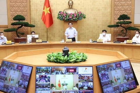 Премьер-министр Фам Минь Тьинь выступает на конференции (Фото: ВИA)