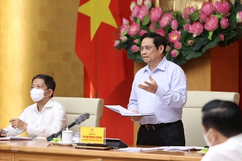 Премьер-министр Фам Минь Тьинь выступает в заключение конференции. (Фото: Зыонг Жанг/ВИА)