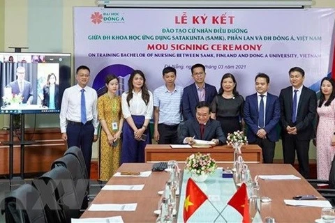 На церемонии подписания между вьетнамским и финским университетами. (Фото: ВИА)