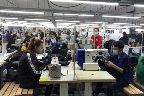 Многие фирмы с ПИИ в центральной провинции Тханьхоа нанимают десятки тысяч рабочих. (Фото: ВИА)