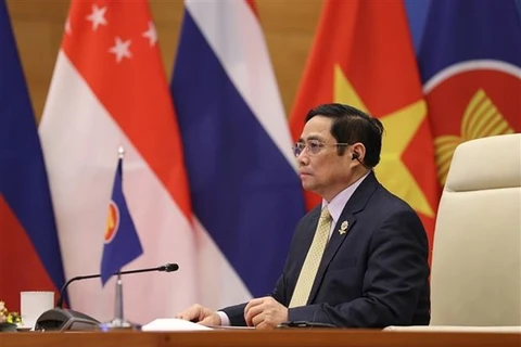 Премьер-министр Фам Минь Тьинь выступает на конференции. (Фото: Зыонг Жанг/ВИА)