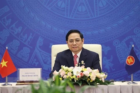 Премьер-министр Фам Минь Тьинь на мероприятии. (Фото: ВИА)
