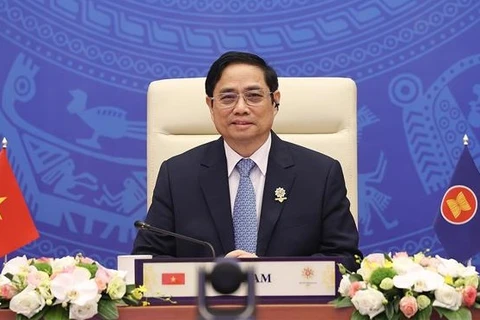 Премьер-министр Фам Минь Тьинь принимает участие в 24-м саммите АСЕАН-Япония. (Фото ВИA) 