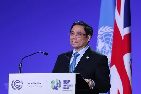 Премьер-министр Фам Минь Тьинь выступает на Саммите по климату (COP26). (Фото: ВИА)