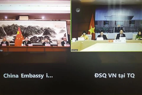 Участиники видеоконференции в Китае и Вьетнаме. (Фото: ВИА)