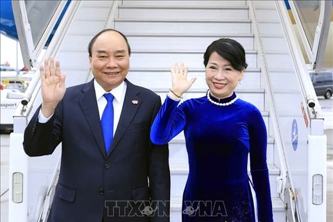 Президент Нгуен Суан Фук с супругой. (Фото: Тхонг Нят/ВИА)