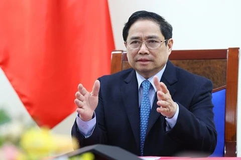 Премьер-министр Фам Минь Тьинь провел телефонный разговор с премьер-министром Китая Ли Кэцяном. (Фото: ВИА)