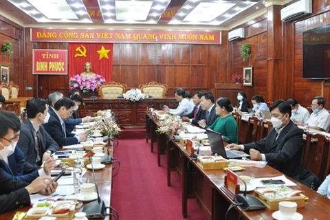 На рабочем заседании (Фото: binhphuoc.gov.vn) 