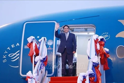 Премьер-министр Фам Минь Тьинь прибыл в Лаос на 4-й саммит MRC. (Фото: ВИА)