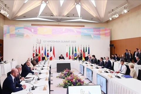 Премьер-министр Фам Минь Тьинь на рабочей сессии расширенного саммита G7 под названием "к мирному, стабильному и процветающему миру". (Фото:ВИA)