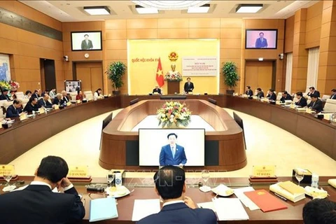 На конференции, посвященной рассмотрению координации между Постоянным комитетом Национального собрания и Президиумом Центрального комитета Отечественного фронта Вьетнама. (Фото: ВИA)