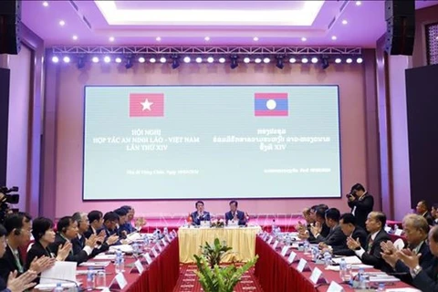 На 14-й конференции по сотрудничеству в области безопасности между Вьетнамом и Лаосом во Вьентьяне, Лаос. (Фото: ВИA)