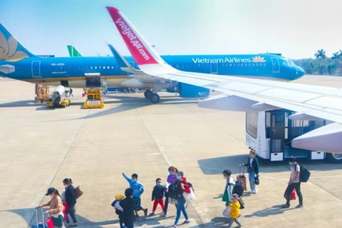  Аэропорт Тхосуан в провинции Тханьхоа. Vietnam Airlines и Vietjet Air внедрили IATA Travel Pass, приложение для электронного паспорта здоровья. (Фото: ВИА)