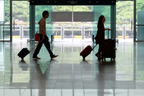 在新加坡樟宜机场的游客（图片来源：新加坡门户网）