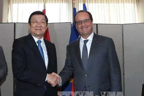 越南国家主席张晋创主席（左）与法国总统弗朗索瓦·奥朗德。