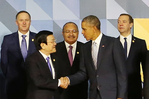 越南国家主席张晋创和美国总统奥巴马出席APEC峰会开幕式（图片来源：越通社）