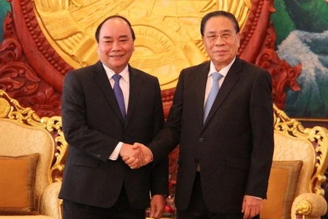 越南政府副总理阮春福礼节性拜会了老挝人民革命党中央总书记、国家主席朱马里（图片来源：越通社）