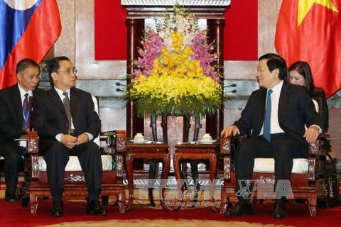 越南国家主席张晋创​（右）与老挝总理通辛·坦马冯（左）