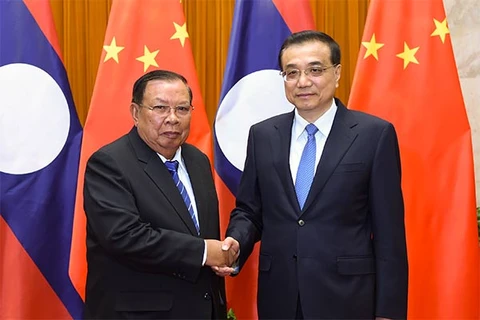 中国国务院总理李克强与老挝国家主席本扬。
