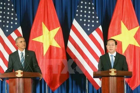 越南国家主席陈大光（​右）与美国总统奥巴马（左）召开记者会（图片来源：越通社）