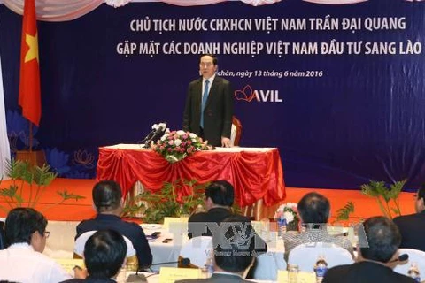 越南国家主席陈大光会见老挝越南投资商（图片来源：越通社）