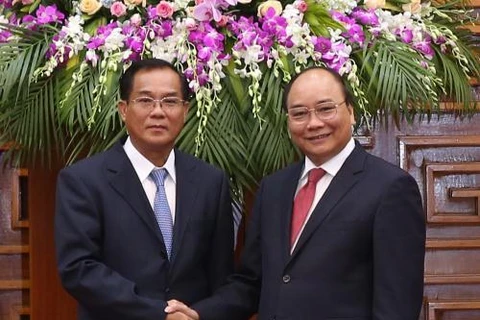 越南政府总理会见老挝计划投资部部长（图片来源：越通社）