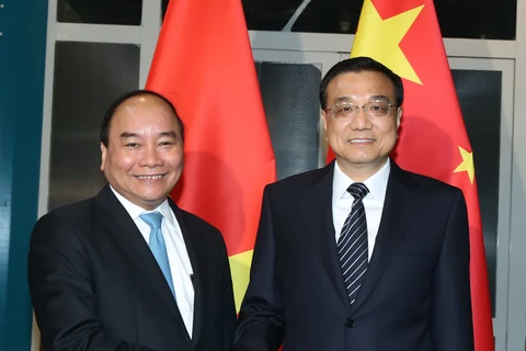 越南政府总理阮春福会见中国国务院总理李克强（图片来源：越通社）