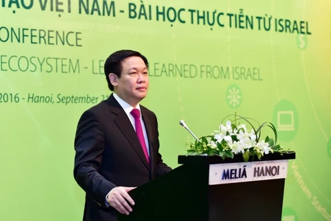 越南政府副总理、企业革新与发展指导委员会主任王廷惠在研讨会山致辞