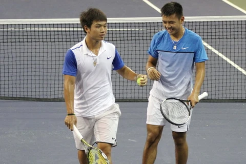 阮黄天和李黄南（右）在比赛中（图：体育报）