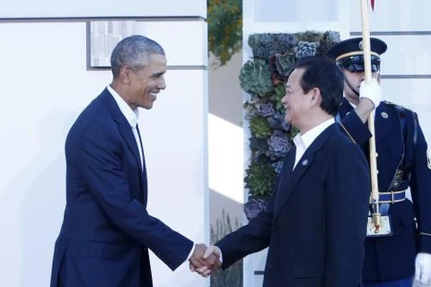 美国总统奥巴马迎接阮晋勇总理。（图片来源：越通社）
