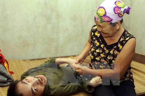越南橙毒剂受害者。（图片来源：越通社）