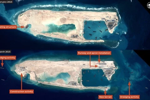 今年2月份卫星图像显示中国在越南长沙群岛的十字礁上非法建设飞机跑道。（图片来源：IHS Jane's Defense Weekly）