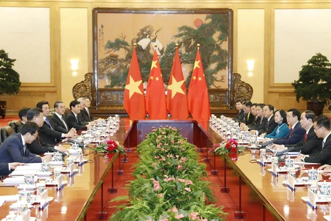 越南国家主席陈大光在北京人民大会堂与中国国家主席习近平举行会谈。（图片来源：越通社）