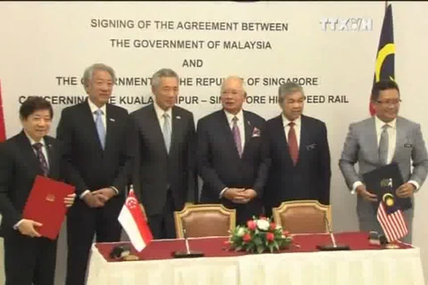 马来西亚与新加坡两国刚在吉隆坡签署马新高铁双边协定