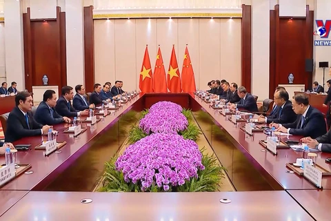 越南政府总理范明政同中国国务院总理李强会谈
