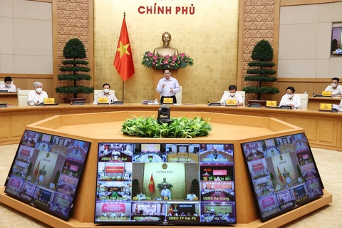 越南政府总理范明政主持召开全国新冠肺炎疫情防控工作视频会议