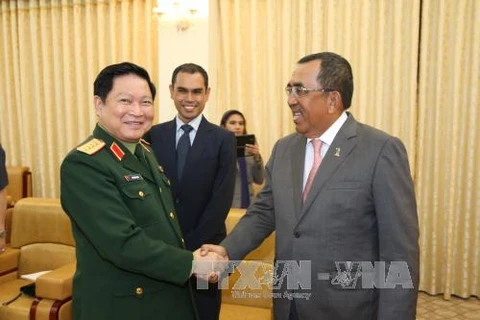马来西亚国防部副部长佐哈里会见越南国防部部长吴春历大将（图片来源：越通社）