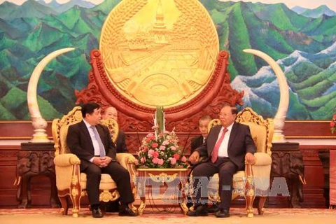 越南计划投资部部长阮志勇与​ 老挝人民革命党中央总书记、国家主席本扬·沃拉吉