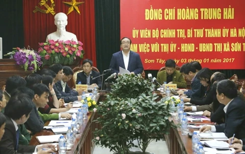 黄忠海同志同山西镇领导人举行工作会议。（图片来源：《人民报》）