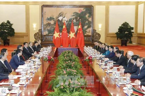 越南国家主席陈大光与中共中央总书记、中国国家主席习近平举行会谈。（图片来源：越通社）