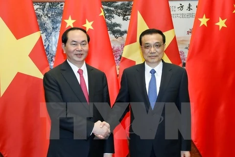 ​越南国家主席陈大光（图左）与中国国务院