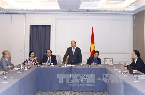 阮春福总理在见面会上发表讲话。（图片来源：越通社）