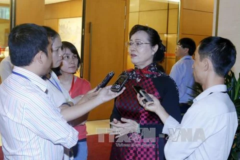 胡志明市国会代表阮氏决心接受记者的采访。
