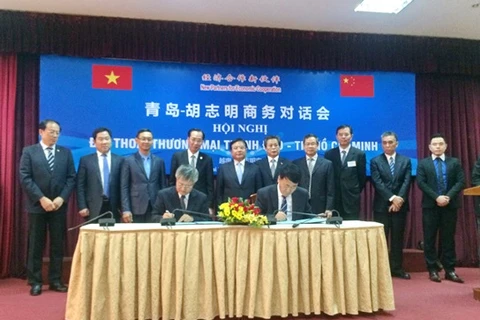附图：胡志明市与青岛代表2016年签署合作备忘录。